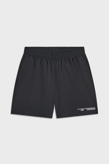 Black TIOTIO Performance Shorts laid flat on a light grey background