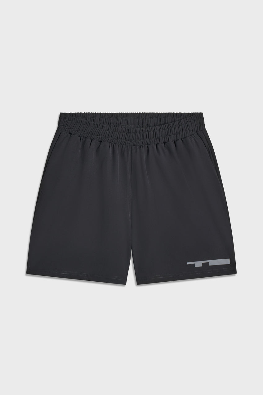 Black TIOTIO Performance Shorts laid flat on a light grey background